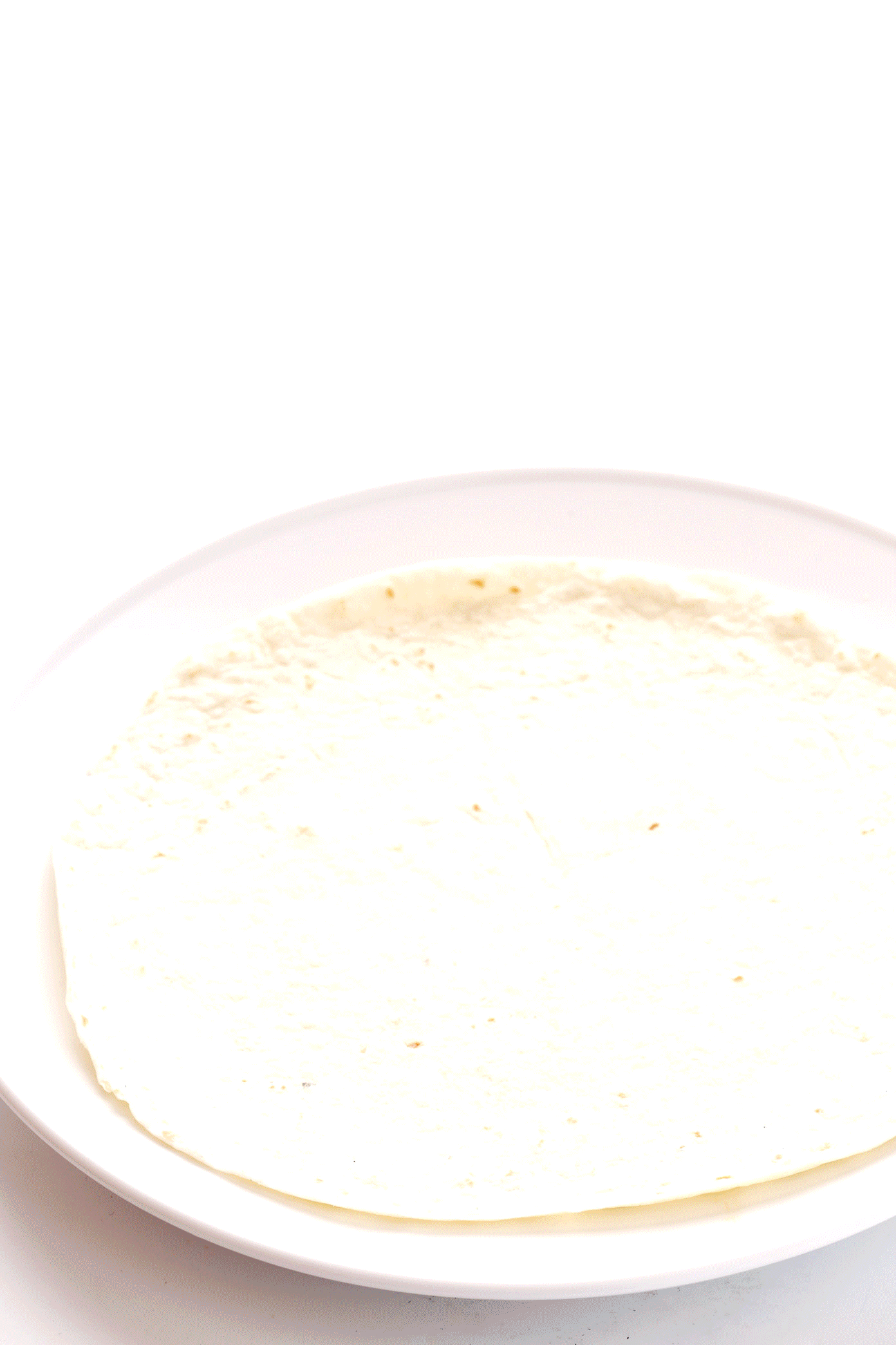 LOVE this easy chicken enchilada recipe! It's made with a delicious homemade enchilada sauce, chicken, cheese, green chiles, beans and whatever other fillings you love most. Always a great recipe when you're craving Mexican (or Tex-Mex) food for dinner -- plus these enchiladas are a great freezer meal for meal prep too. | gimmesomeoven.com Step by Step of How To Make Chicken Enchiladas