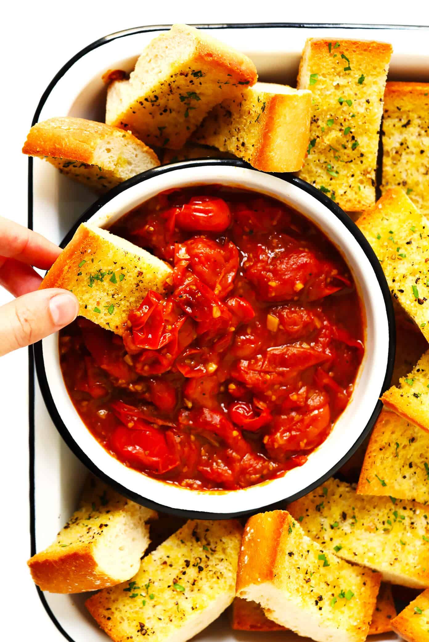 This garlicky Burst Tomato Spread is easy to make with just 5 ingredients and tastes AMAZING served warm with crusty bread. It's the perfect easy appetizer for summertime! | gimmesomeoven.com #tomato #spread #dip #glutenfree #vegan #healthy #appetizer #summer #entertaining Burst Tomato Spread