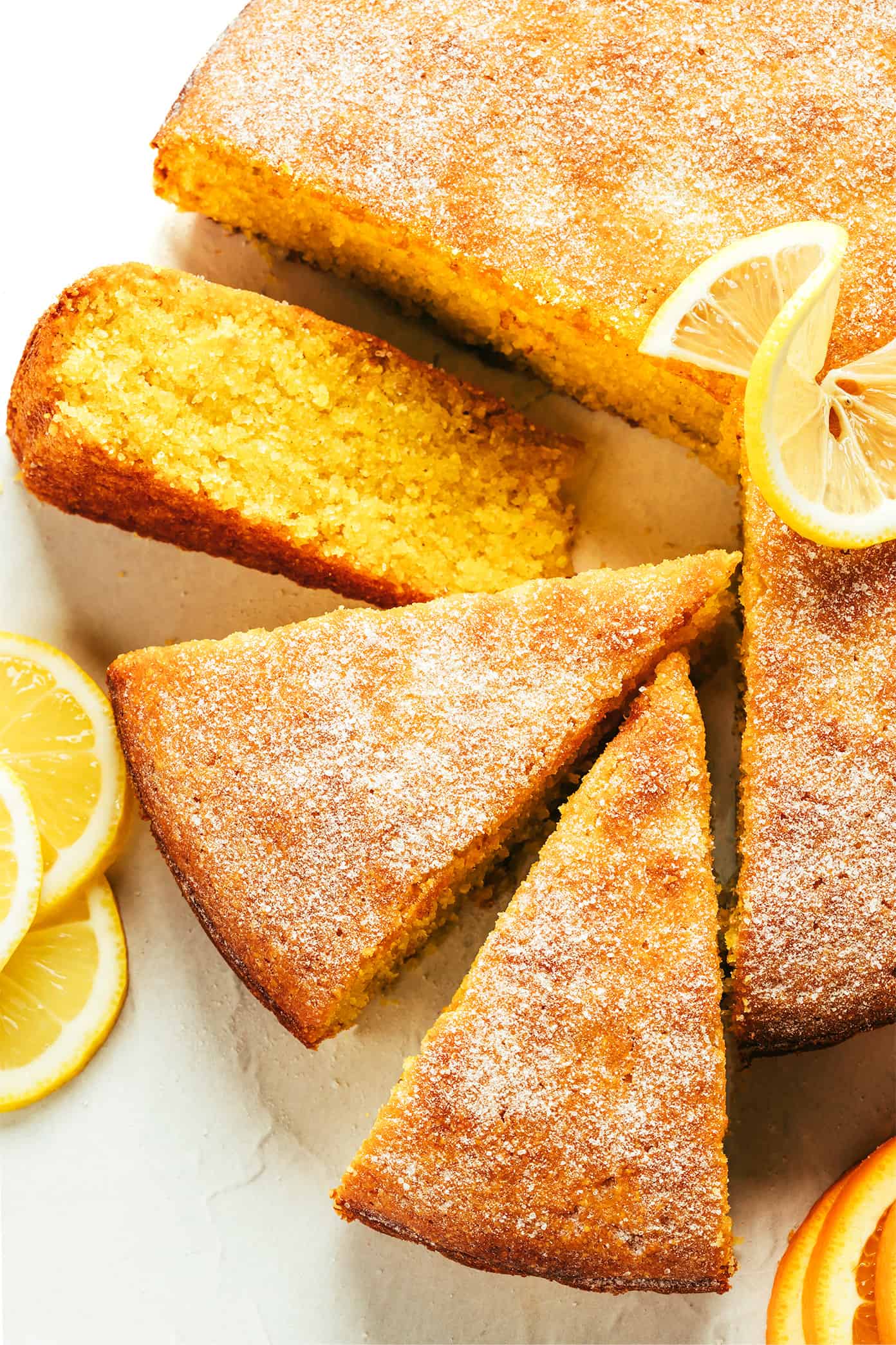 This citrus olive oil cake recipe is easy to make in one bowl, naturally gluten-free and dairy-free, lightly sweetened, and made with the loveliest hints of fresh orange and lemon. Perfect for dessert, snacking or even breakfast and always so delicious. Serve on its own or with whipped cream, ice cream or fruit and enjoy! | gimmesomeoven.com Citrus Olive Oil Cake Slices