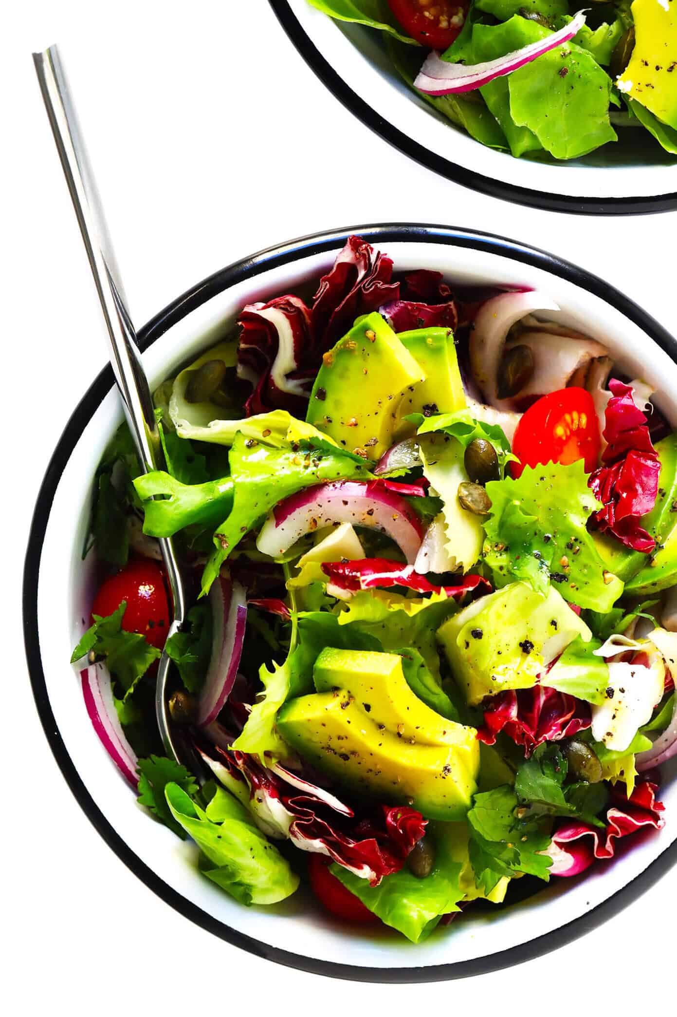 This delicious Everyday Mexican Salad recipe is quick and easy to make, totally customizable with your favorite ingredients, and it can work perfectly as a side salad or main dish! Feel free to add extra protein (chicken, steak, carnitas, shrimp, salmon, tofu, etc.), beans, cheese, or veggies if you would like! | gimmesomeoven.com #salad #mexican #healthy #side #avocado #vegetarian #vegan #glutenfree #dinner #mealprep Mexican Side Salad