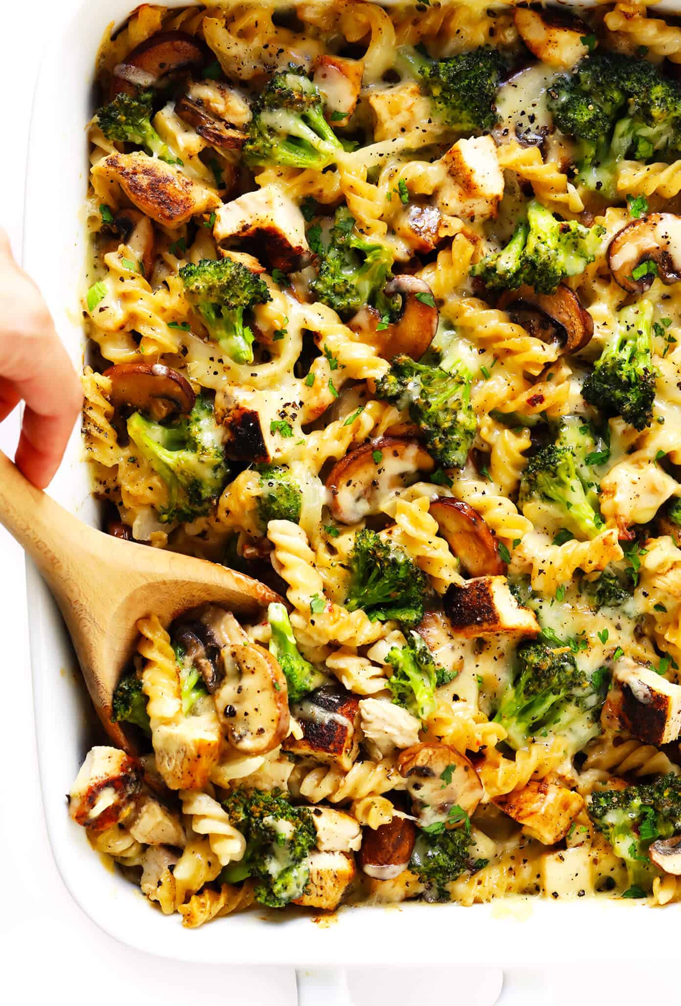 This healthier Broccoli Chicken Casserole recipe is made with your choice of pasta, tender chicken and broccoli, and the most delicious creamy cheddar mushroom sauce. It's modern comfort food at its best! | gimmesomeoven.com #chicken #casserole #dinner #comfortfood #healthy #glutenfree #mealprep #pasta Healthier Broccoli Chicken Casserole