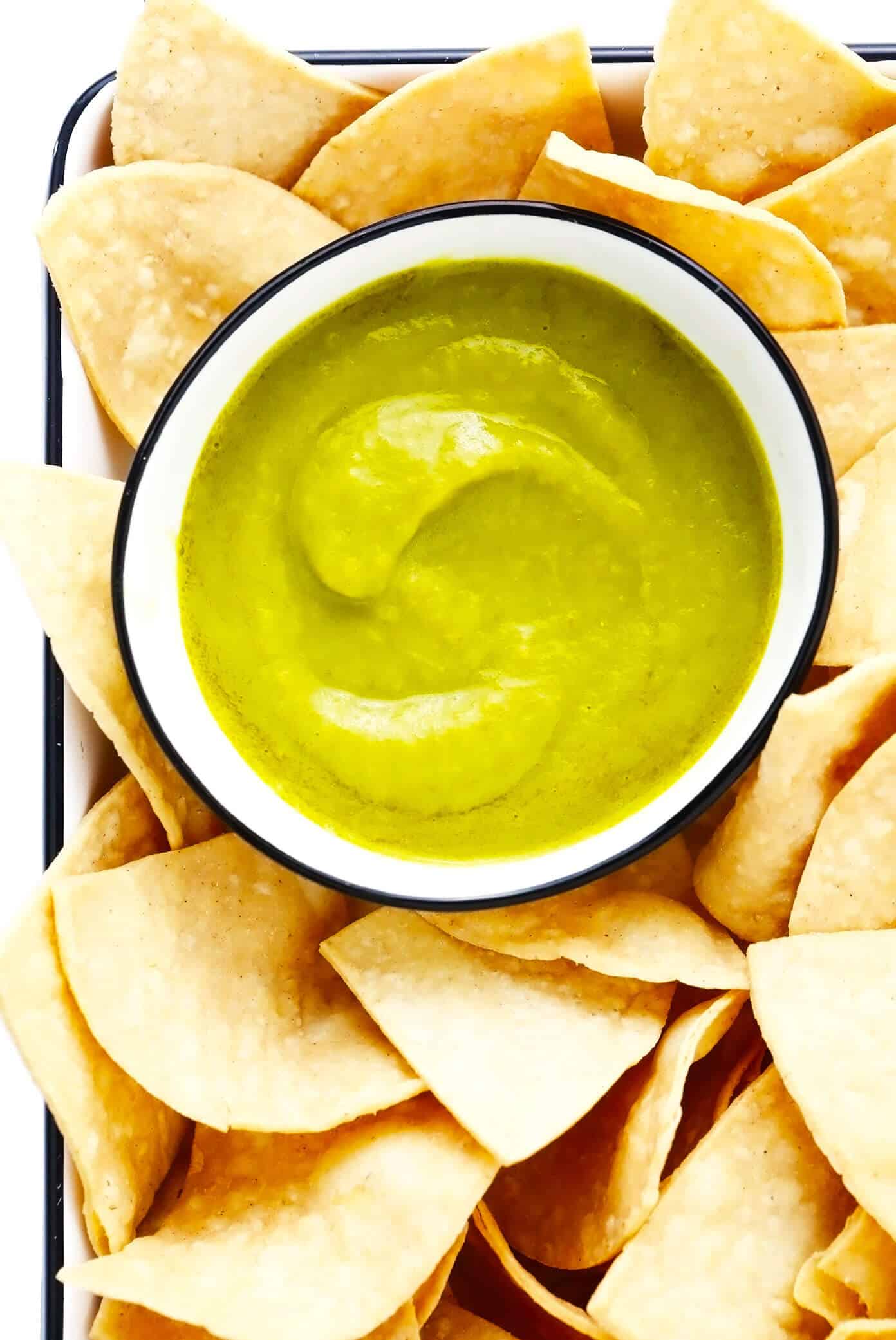 This 5-ingredient creamy jalapeño salsa recipe is easy to make in 30 minutes and irresistibly garlicky and flavorful. Perfect for dipping with chips or drizzling on whatever other Mexican-inspired dishes you love best. It is naturally gluten-free and vegan, and options are included to make this salsa as mild or spicy as you prefer. | gimmesomeoven.com Copycat Salsa Doña Recipe with Tortilla Chips