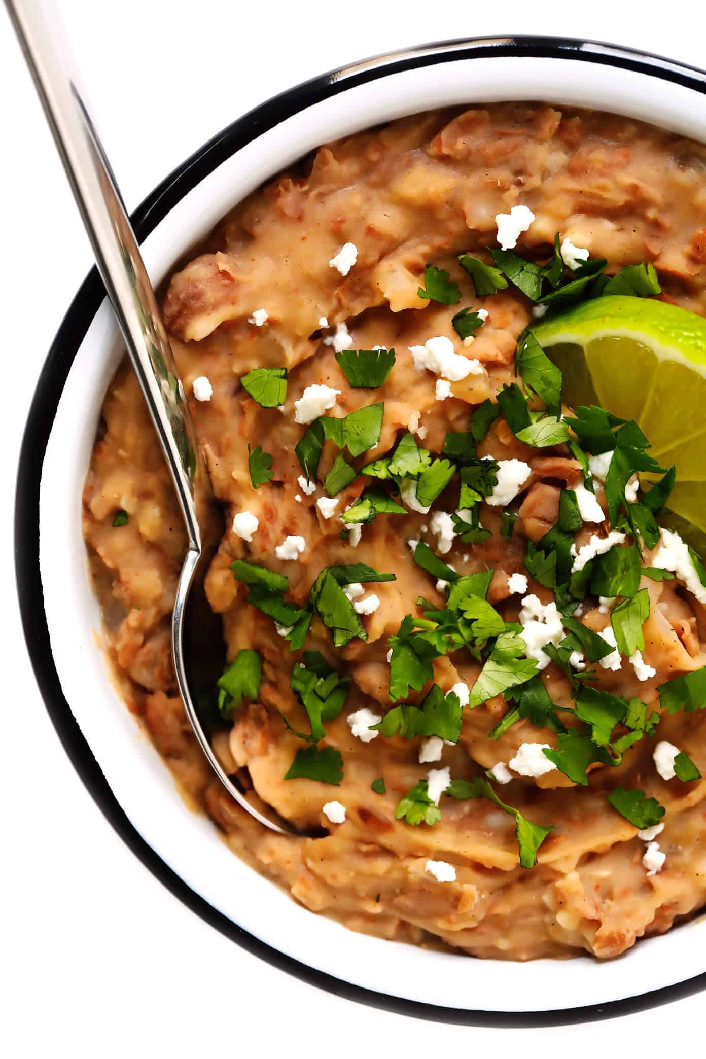 This homemade refried beans recipe is easy to make in about 20 minutes with vegetarian ingredients you can feel great about! It's the perfect easy Mexican side dish, or can be added to tacos, burritos, enchiladas and more. Or just serve with tortilla chips as an easy dip! | gimmesomeoven.com #refriedbeans #mexican #dip #side #glutenfree #vegetarian #vegan #healthy #cincodemayo Refried Beans Recipe