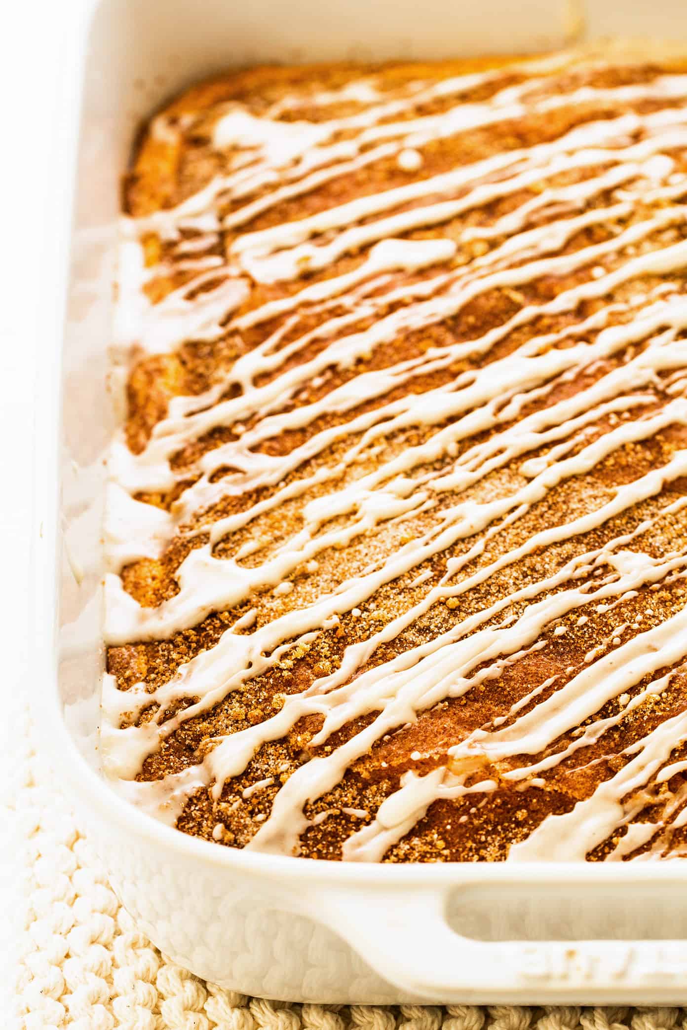 My favorite sour cream coffee cake recipe is perfectly soft and fluffy, layered with cinnamon sugar, and always so delicious. It's the perfect sweet treat for breakfast, snack or dessert, and always so nostalgic and comforting. | gimmesomeoven.com Homemade Coffee Cake in Baking Pan