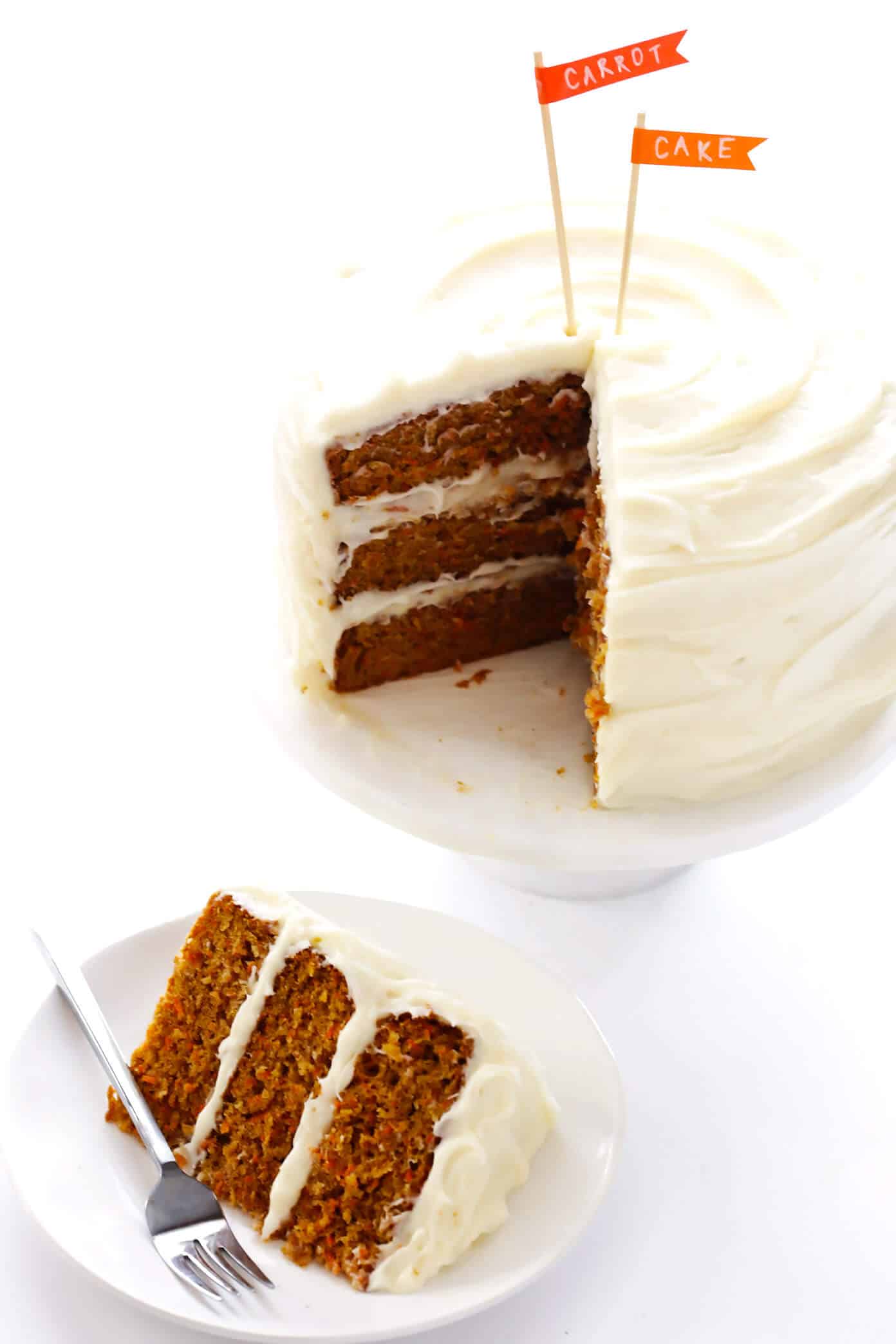 The BEST Carrot Cake Recipe! It's made with an easy homemade carrot cake (no mixer required) and the most heavenly cream cheese frosting. | gimmesomeoven.com #carrot #cake #dessert #easter #creamcheese #frosting #spring #vegetarian The Best Homemade Carrot Cake Recipe